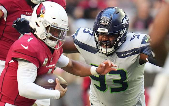 Seattle Seahawks defensive end Shelby Harris (93) closes in on Arizona Cardinals quarterback Kyler Murray (1) at State Farm Stadium.